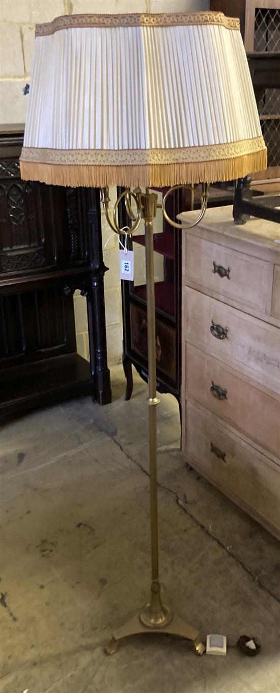 A brass standard lamp with French Horn light holders, height 174cm